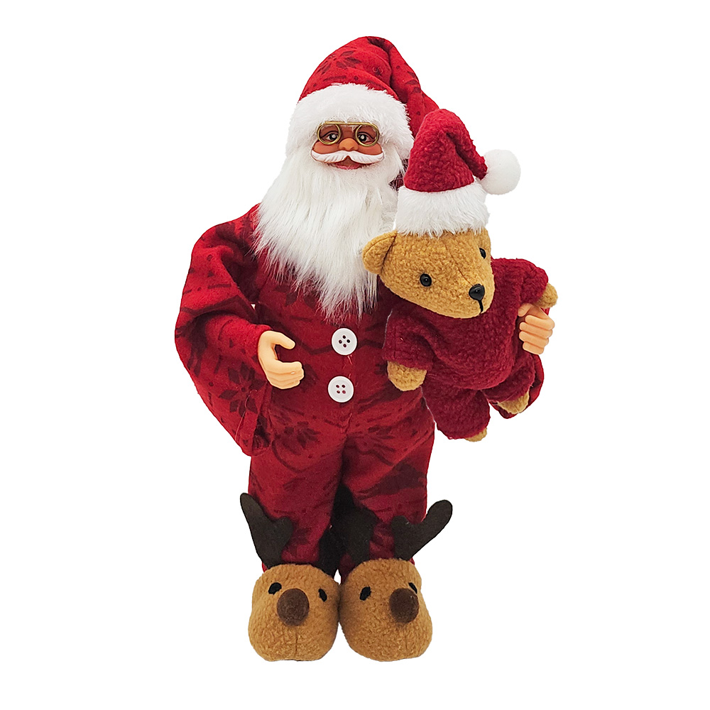 Image Père Noël en pyjama avec ourson en peluche